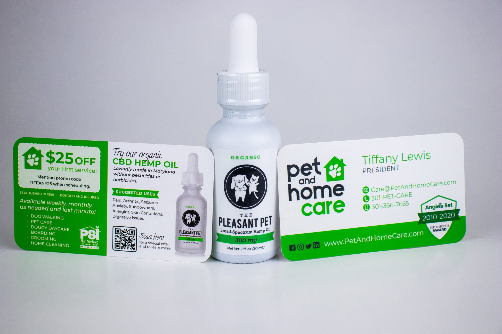 a bottle of pet cbd oil and pet and home care business cards
